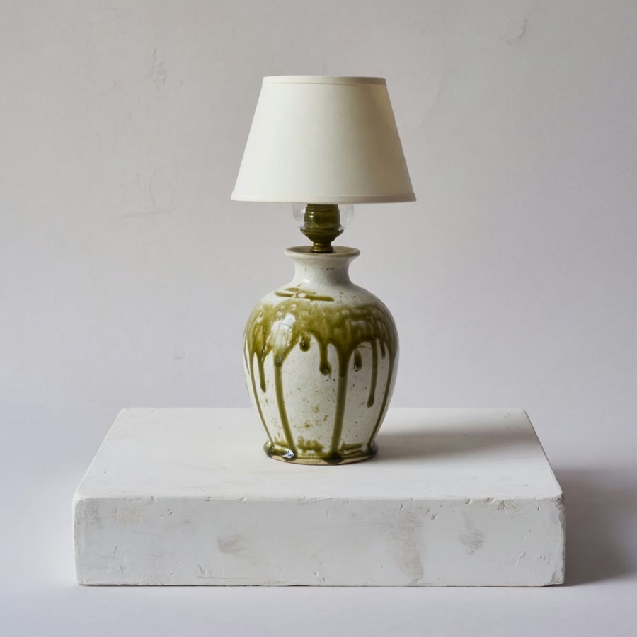Handmade ceramic table lamp on a plaster plinth